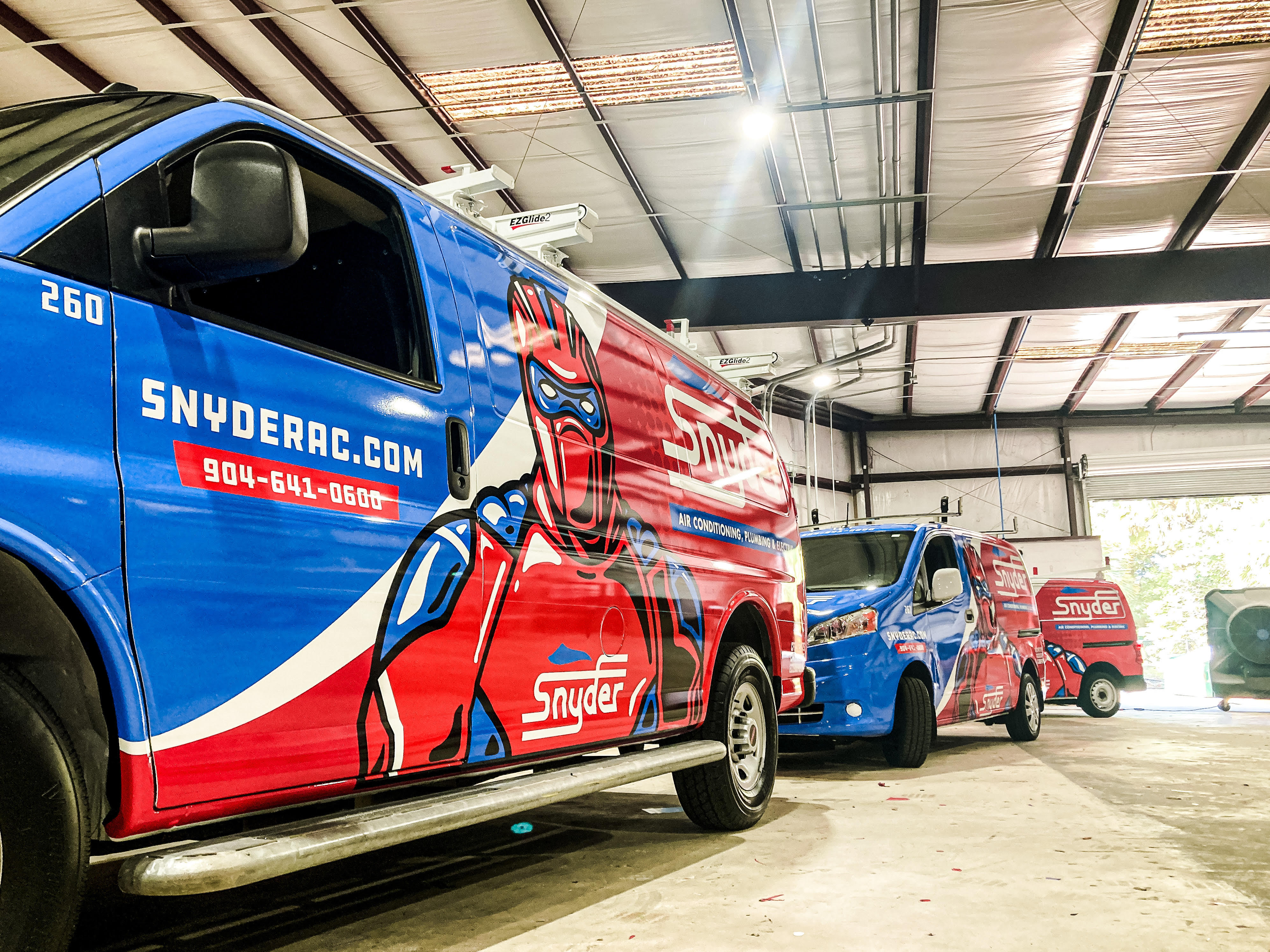 Fleet of vans with graphics wraps