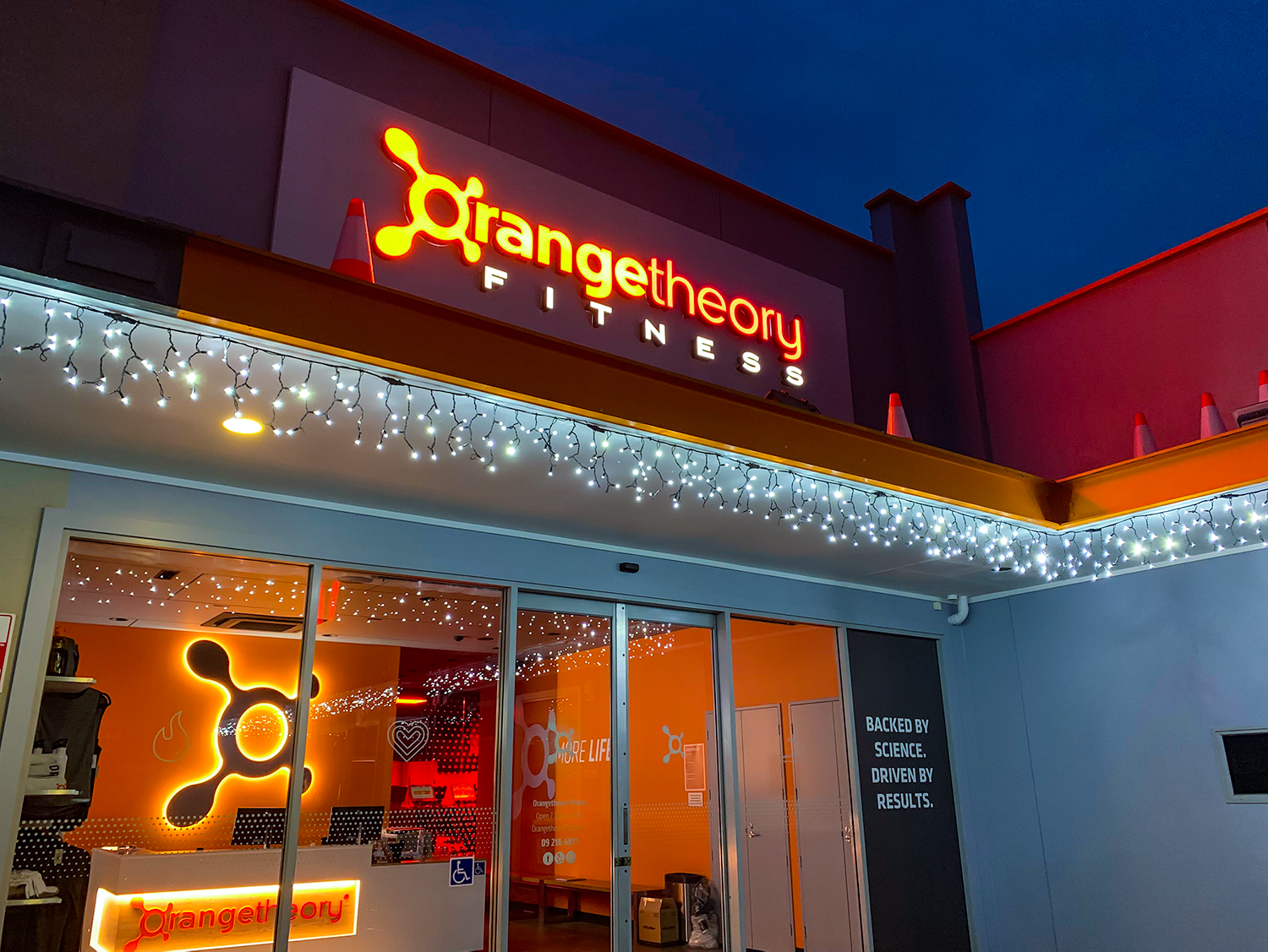 interior and extior illuminated signage for orange theory fitness