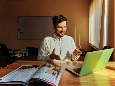 Man on a computer call.