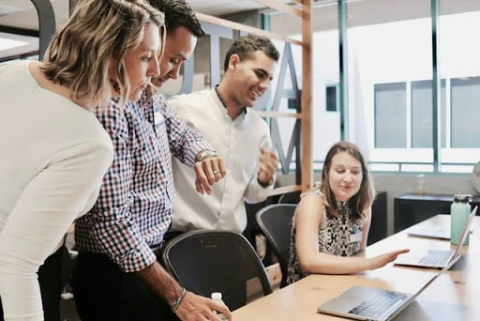 Group of employees works together.